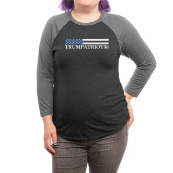 Person wearing a black and gray long-sleeve shirt with 'TRUMPATRIOT88' design.